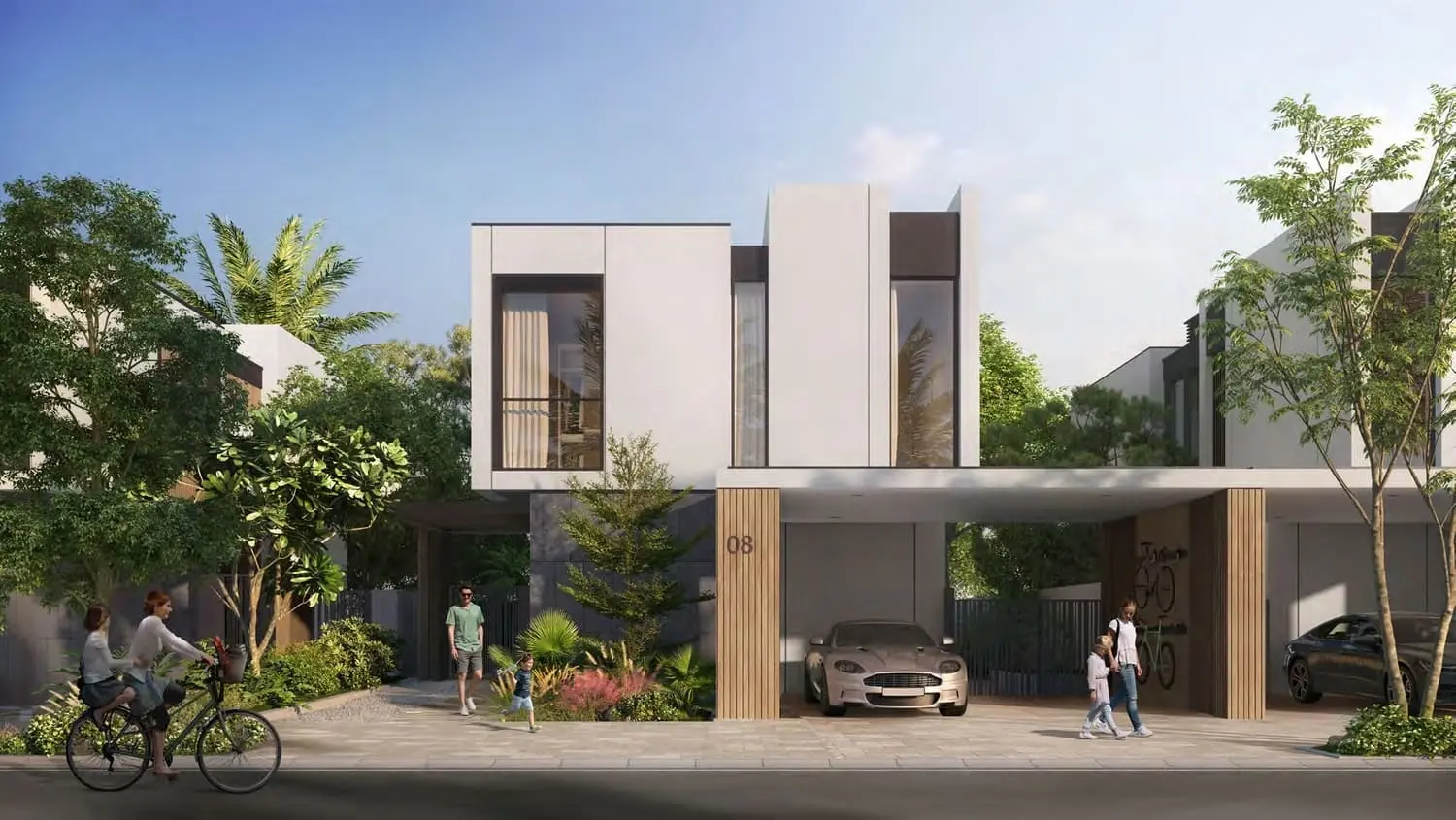 Front elevation of a Greenwoods townhouse in Dubai Silicon Oasis, with a planted forecourt.